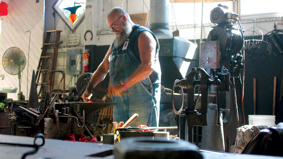 Steve White, a blacksmith from Kilduff, works at the fair every year.